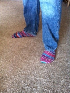 Husband modeling his socks.